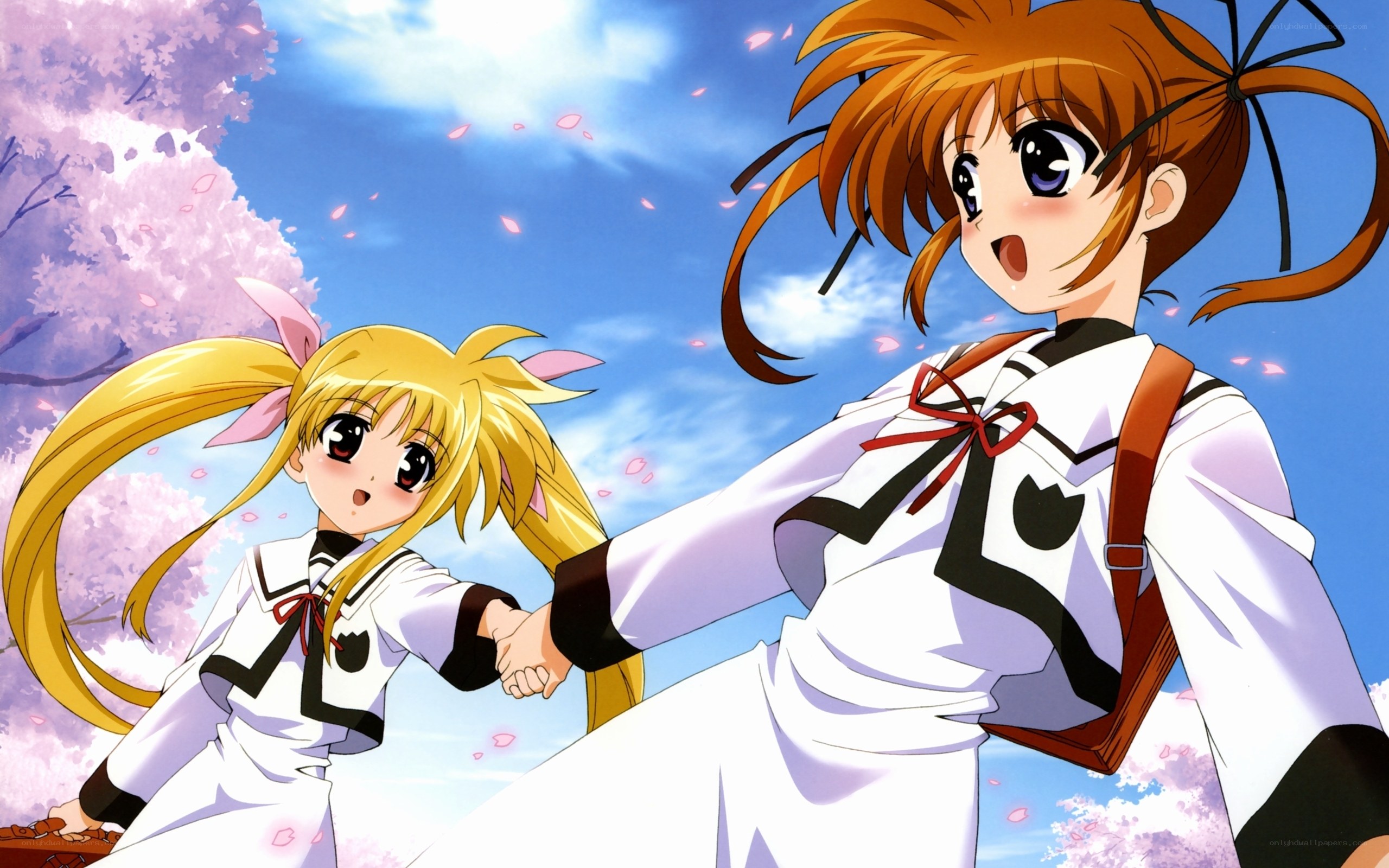 two girls holding hands under cherry blossoms