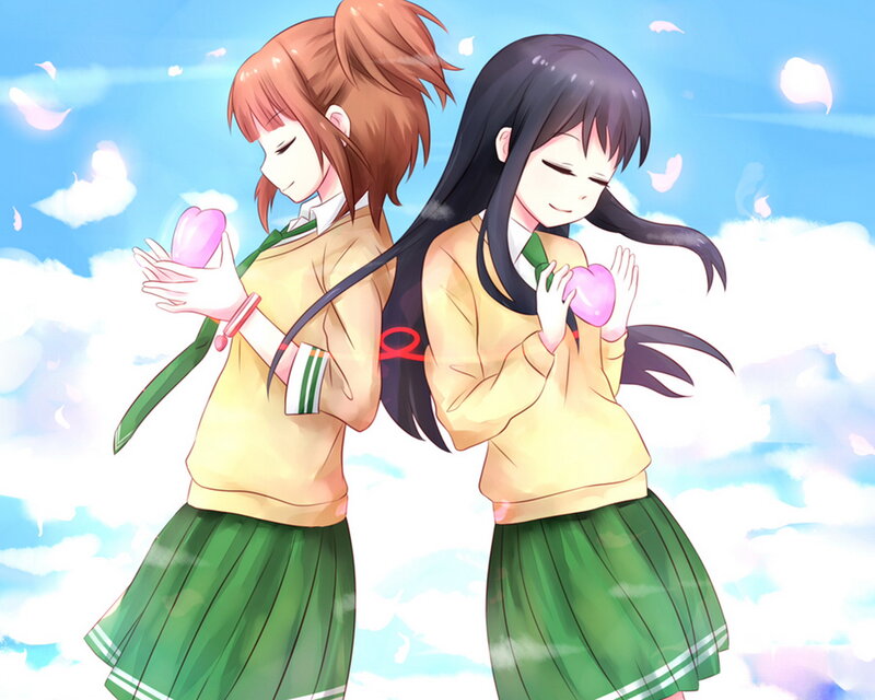 Two Girls Holding Hearts