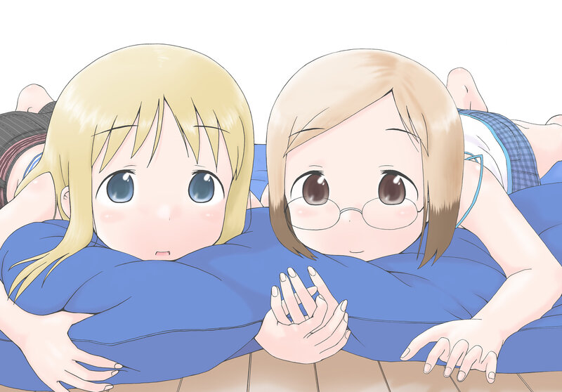 Two girls hugging a pillow