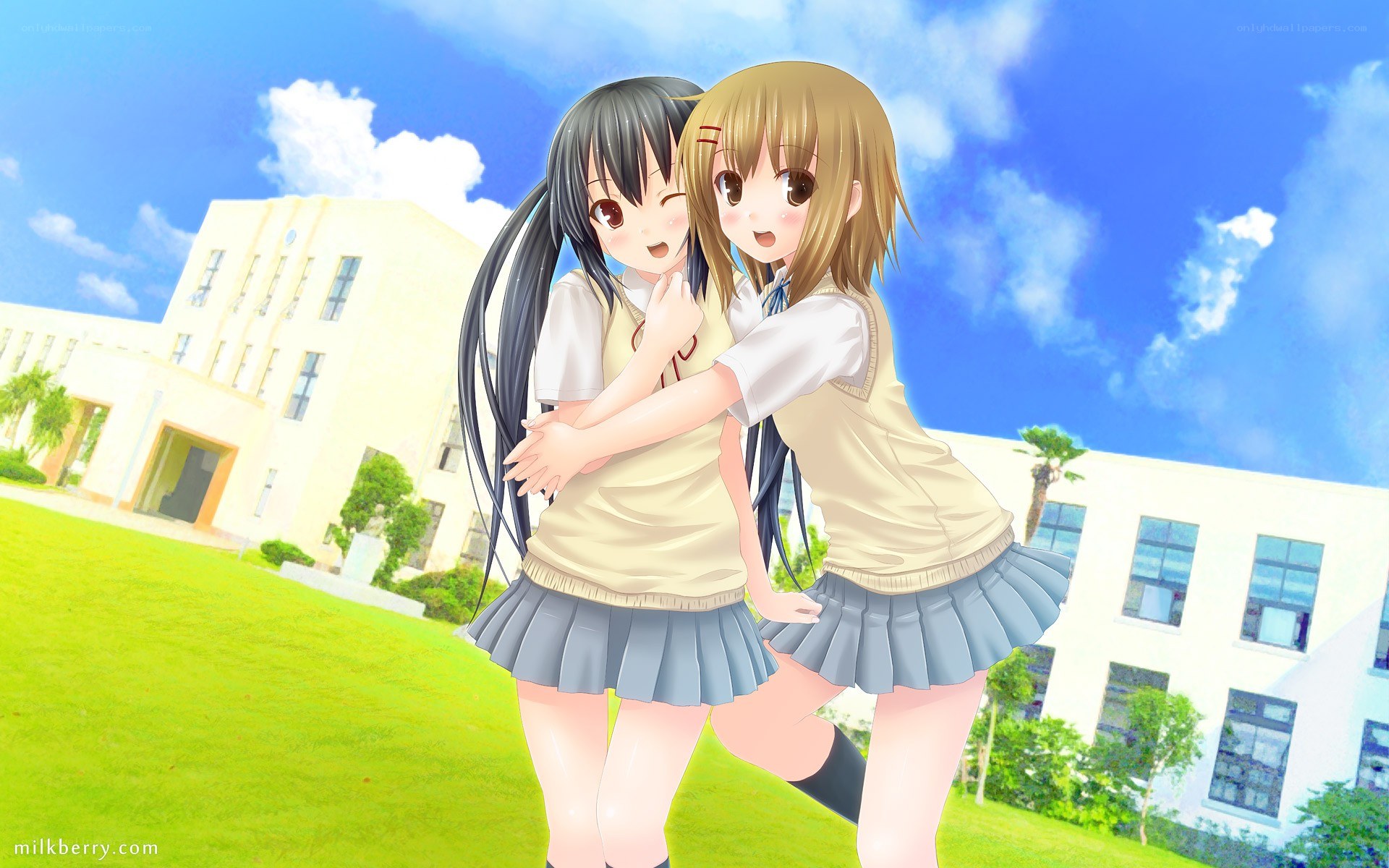 Two girls hugging at school