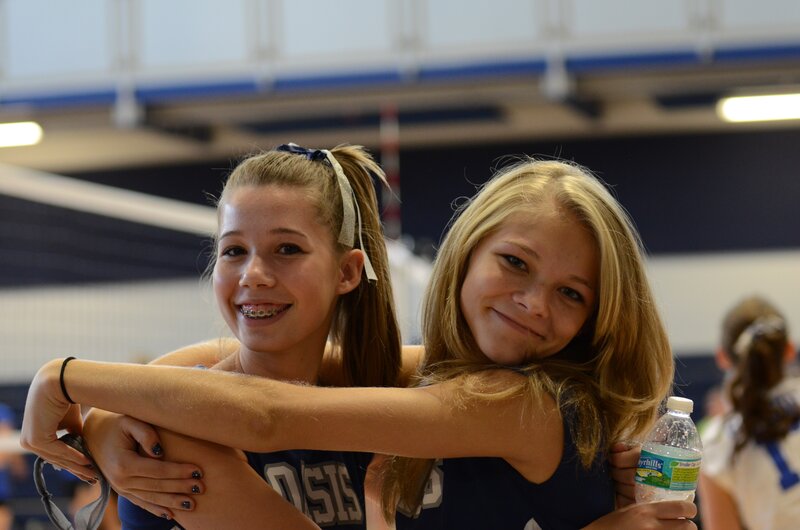 Two Girls Hugging — Blue, Happy, Photograph