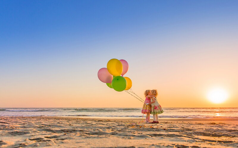 Two Girls Hugging — Blue, Serene, Sunset