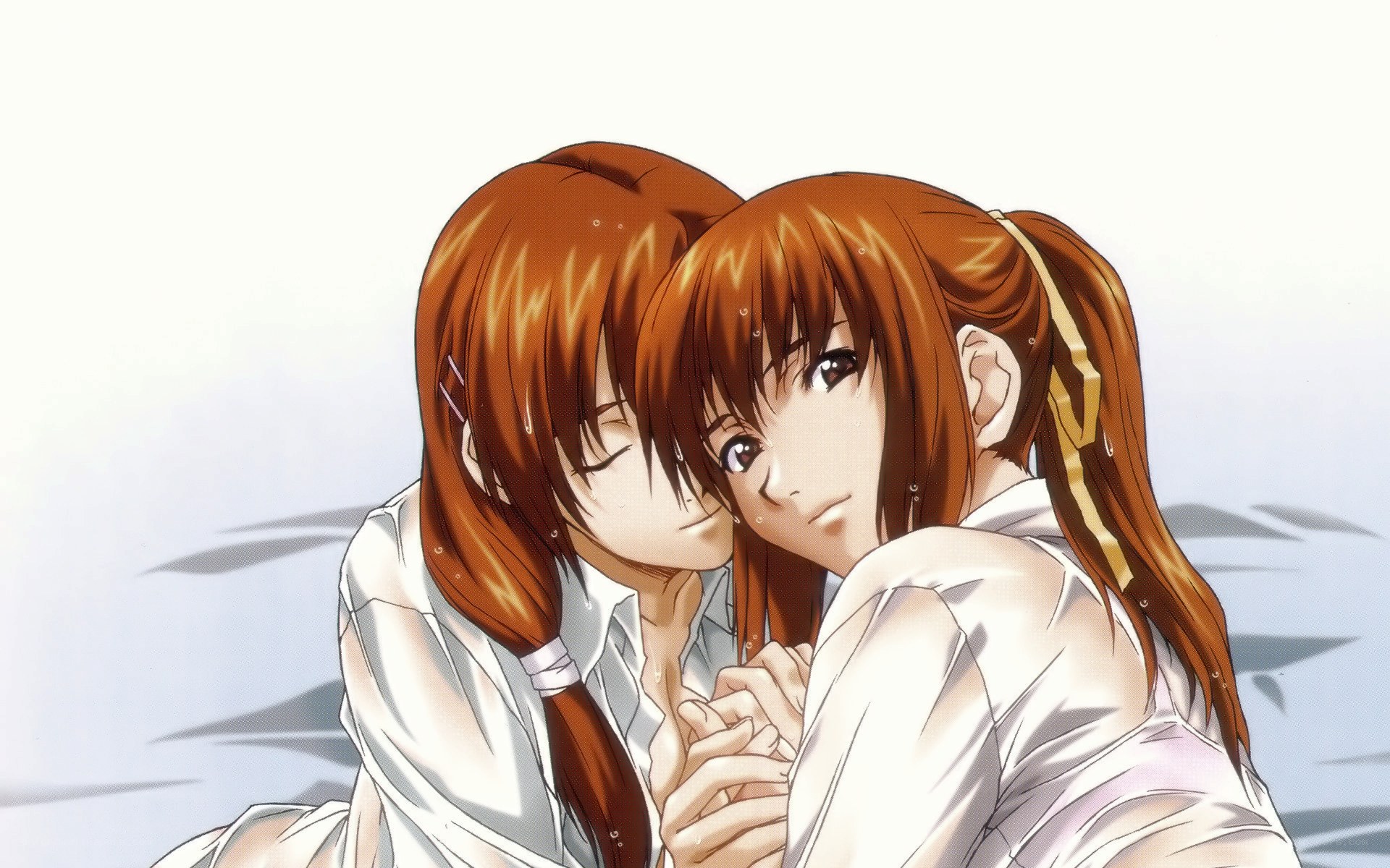 two girls hugging closely