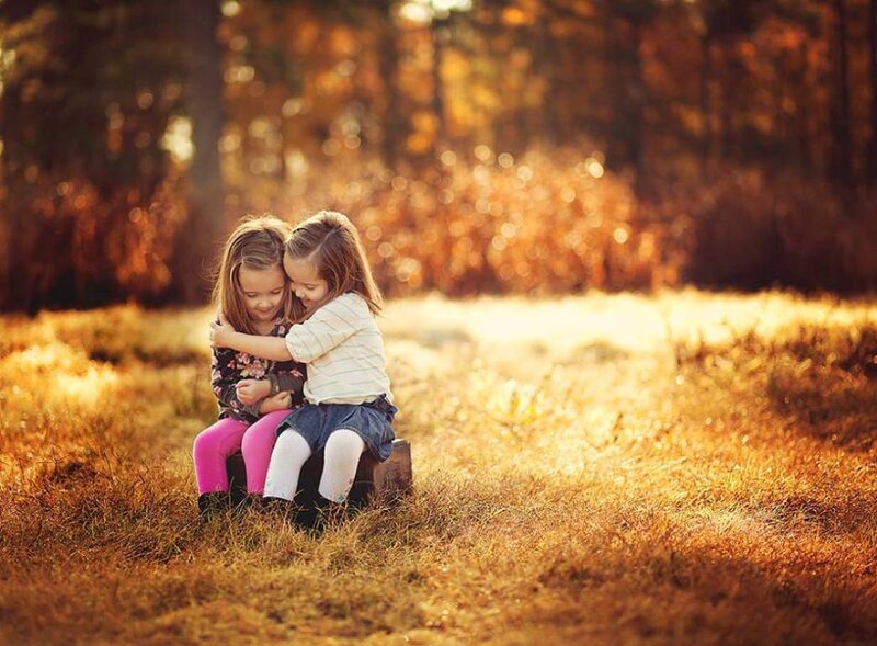 Two Girls Hugging — Golden