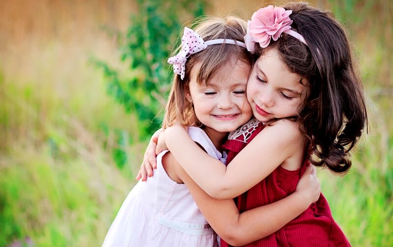Two Girls Hugging — Green, Affectionate