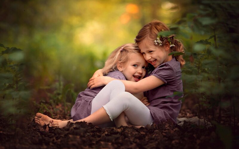 Two Girls Hugging — Green, Peaceful, Afternoon