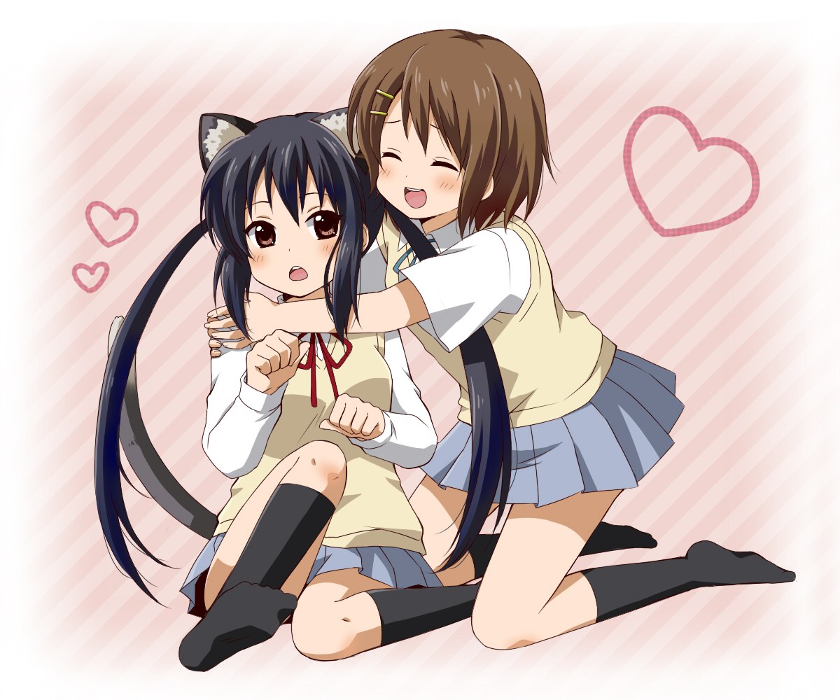 Two girls hugging happily