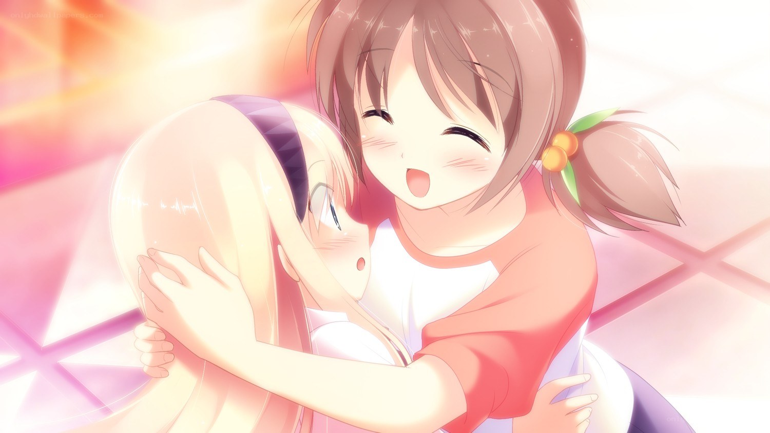 Two girls hugging happily