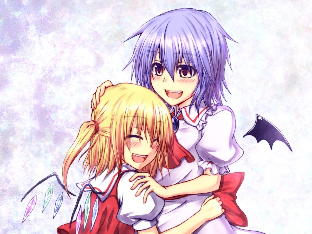 Two girls hugging happily