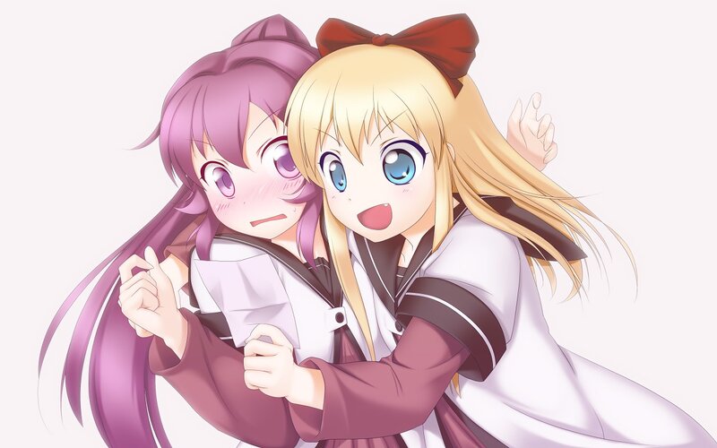 Two girls hugging happily