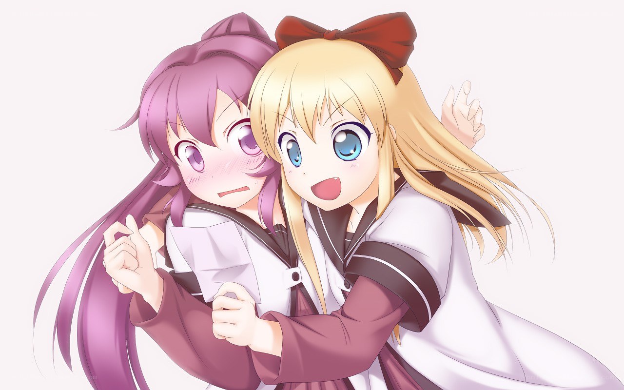 Two girls hugging happily