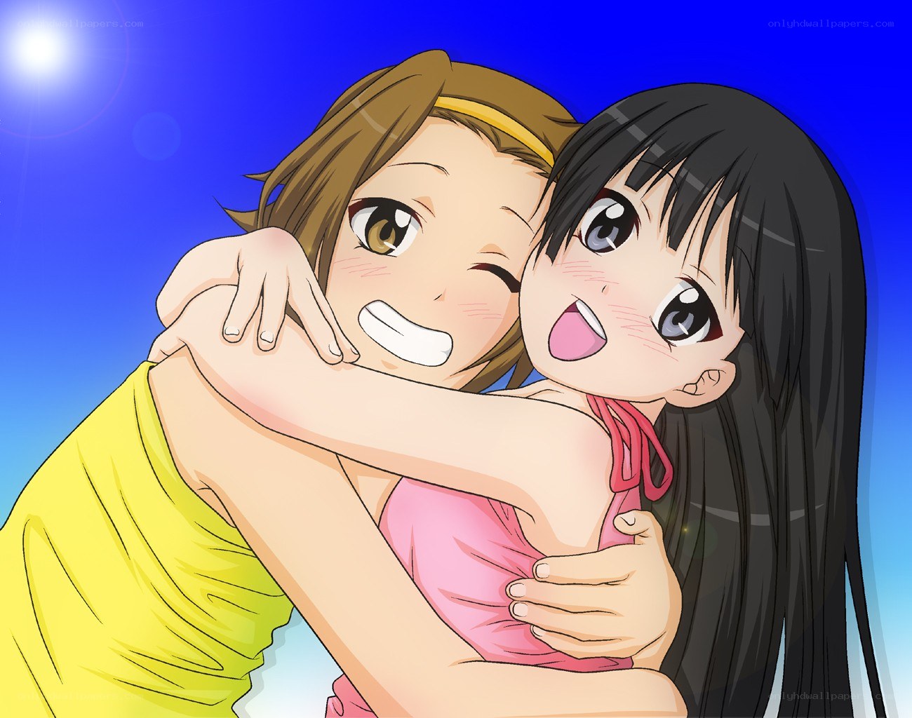 Two girls hugging happily