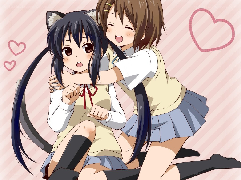 Two girls hugging happily