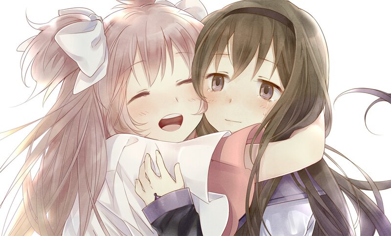 Two girls hugging happily