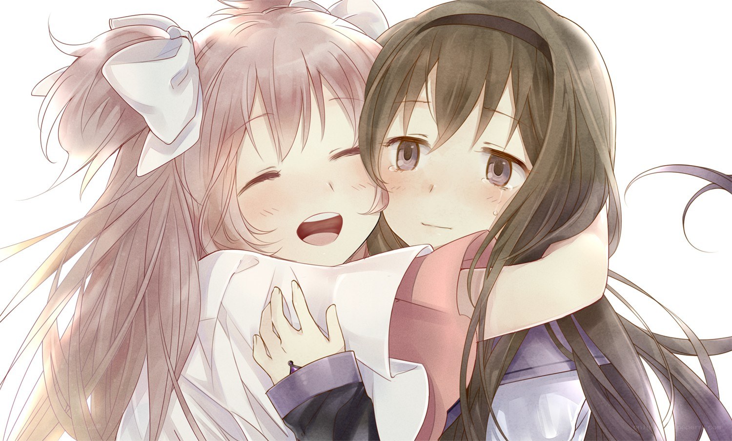 Two girls hugging happily