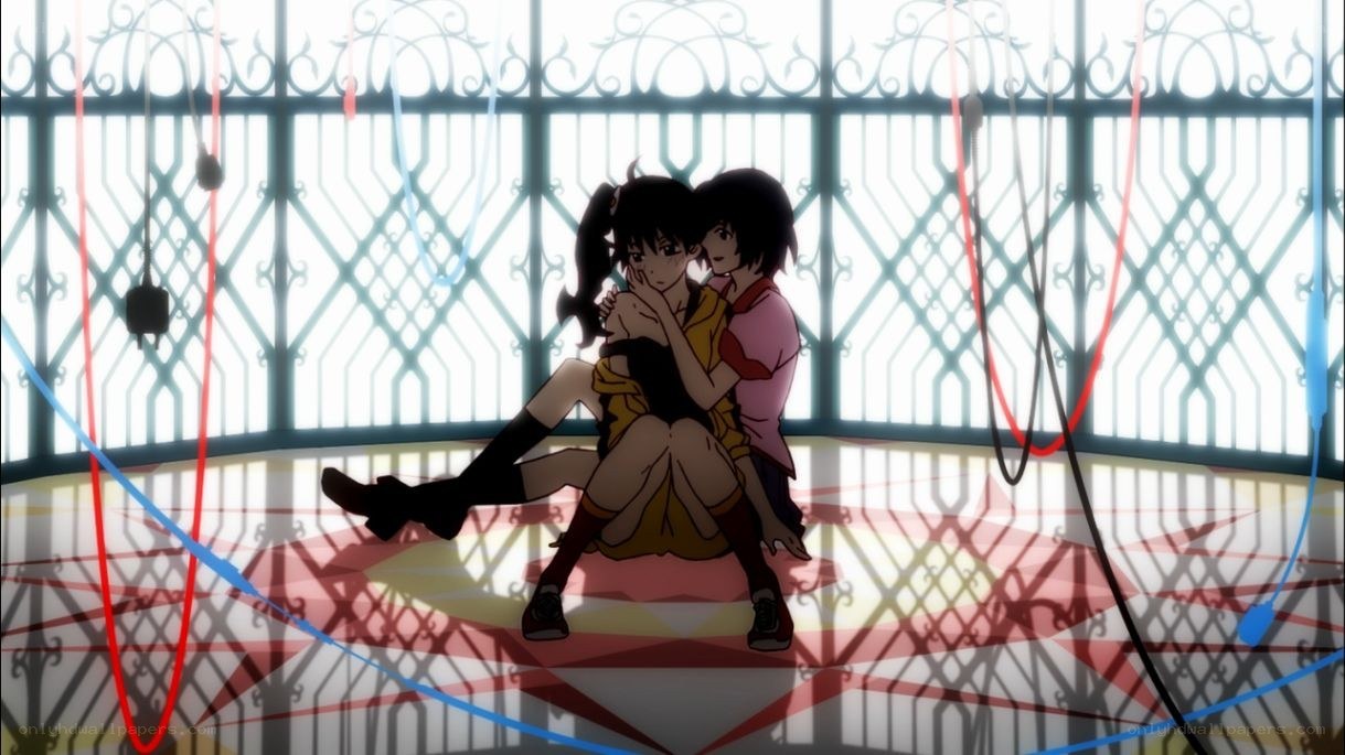 Two girls hugging in a cage