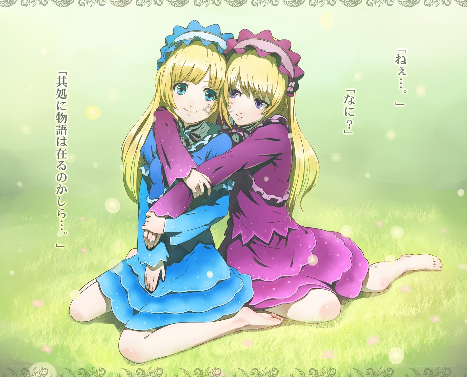 Two girls hugging in a field