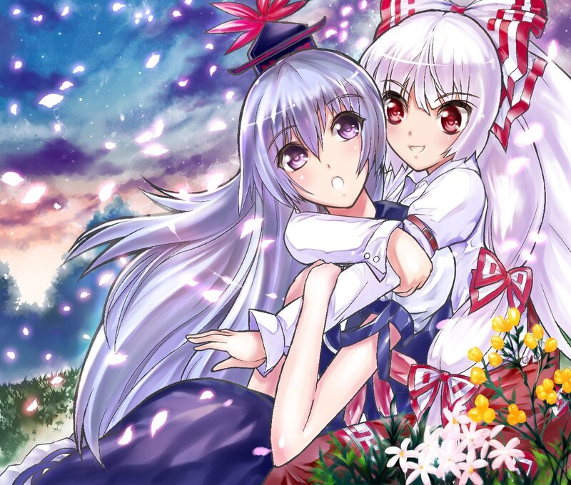 Two girls hugging in a flower field