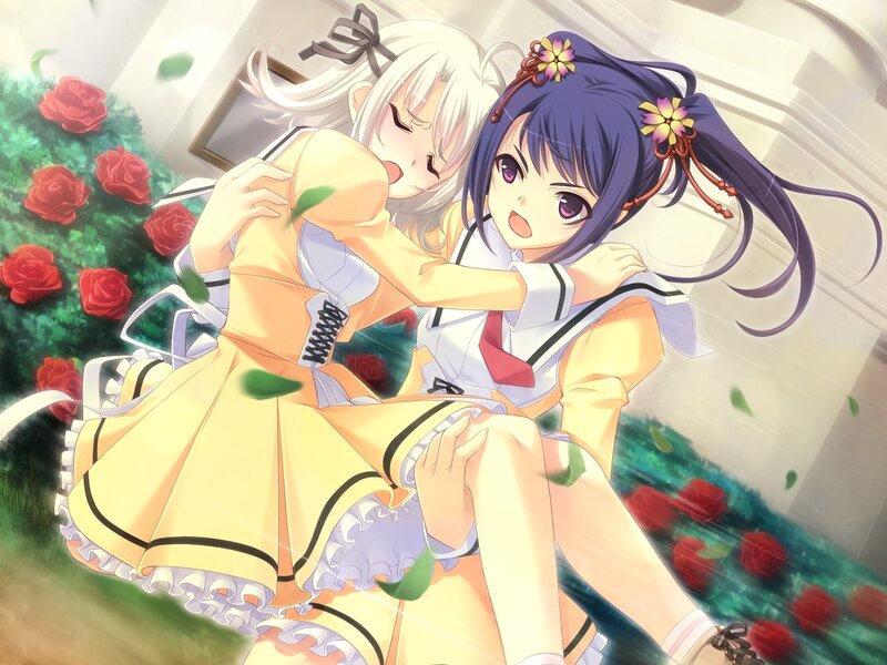 Two girls hugging in a garden