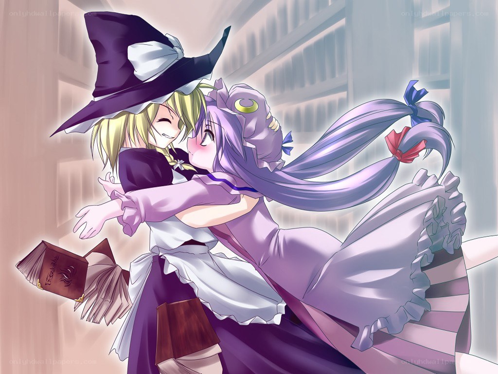 Two girls hugging in a library