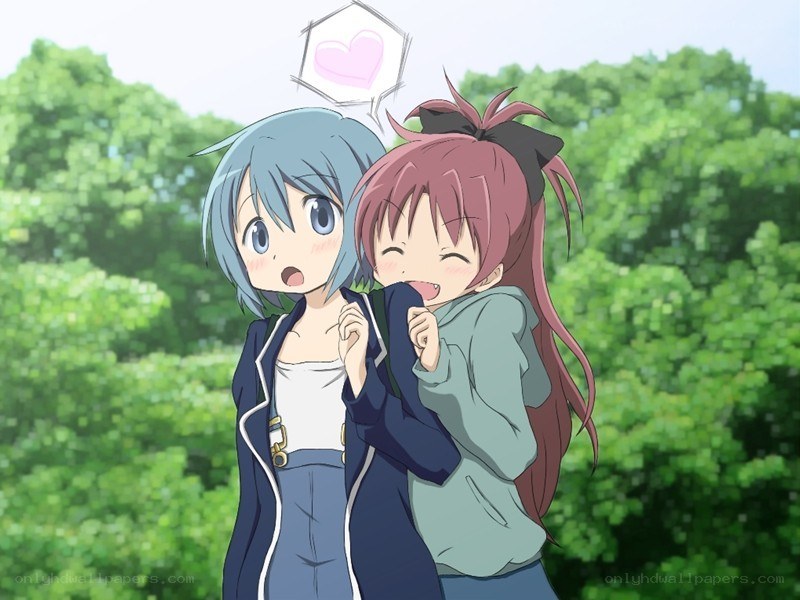 Two girls hugging in a park