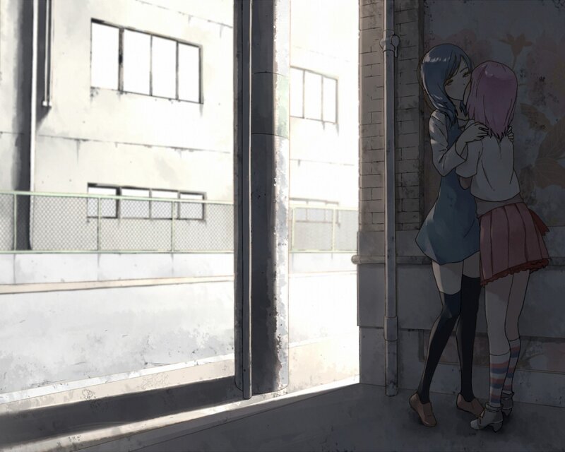 Two girls hugging in an alley