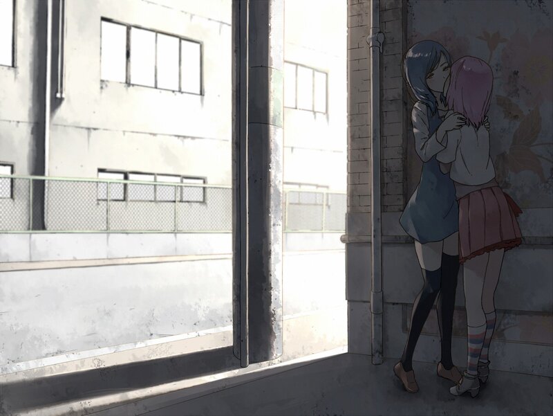 two girls hugging in an alley