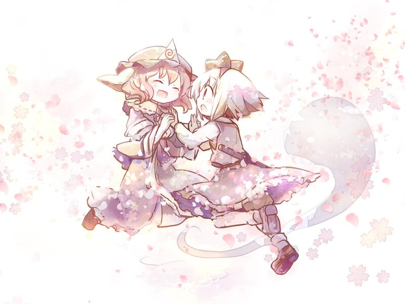 Two girls hugging in cherry blossoms