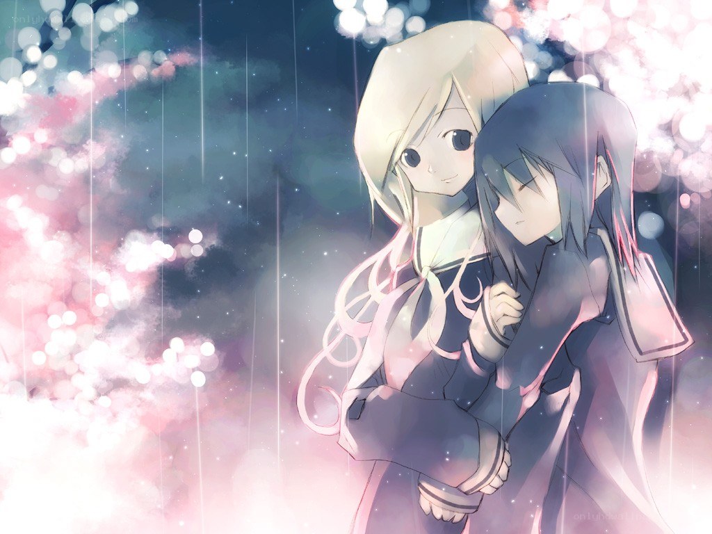 two girls hugging in rain
