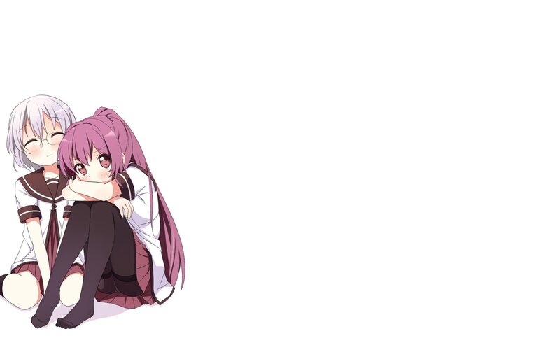two girls hugging in school uniforms
