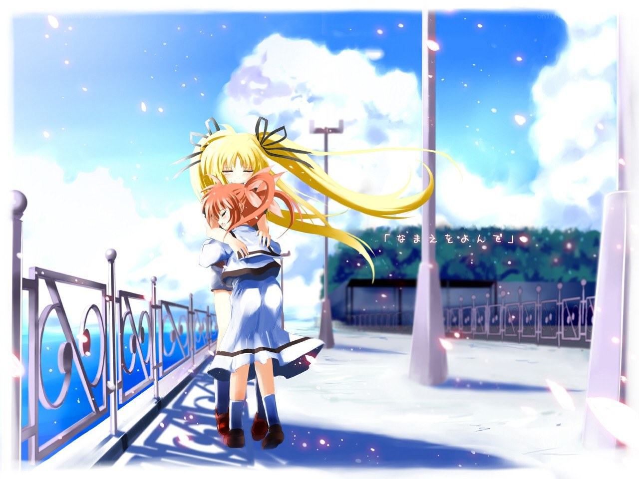 Two girls hugging on a bridge