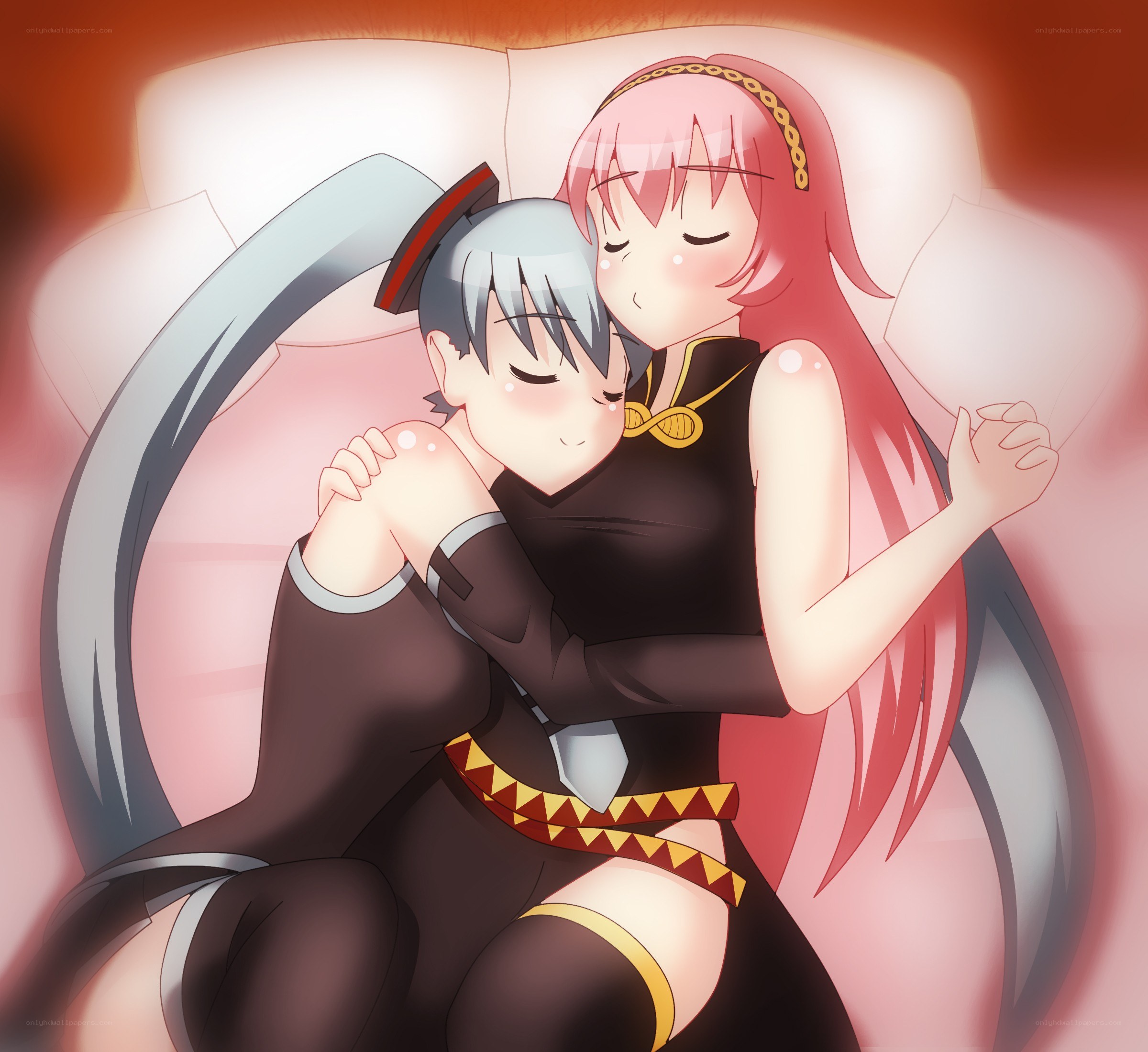 Two girls hugging on a couch