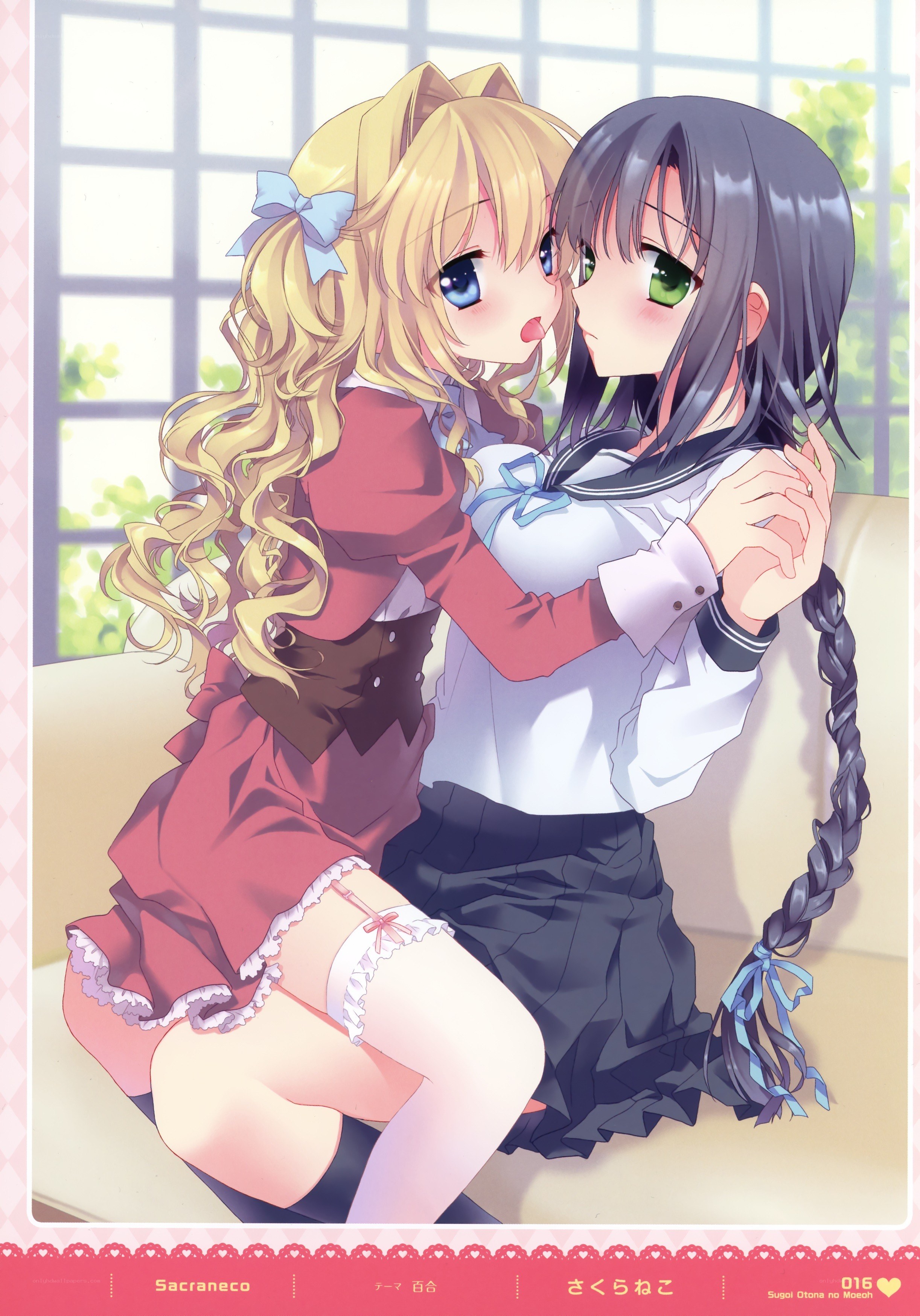 Two girls hugging on a couch