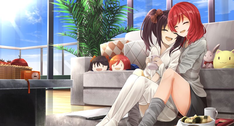 Two Girls Hugging on Couch