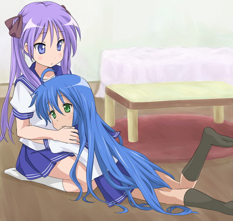 Two girls hugging on the floor
