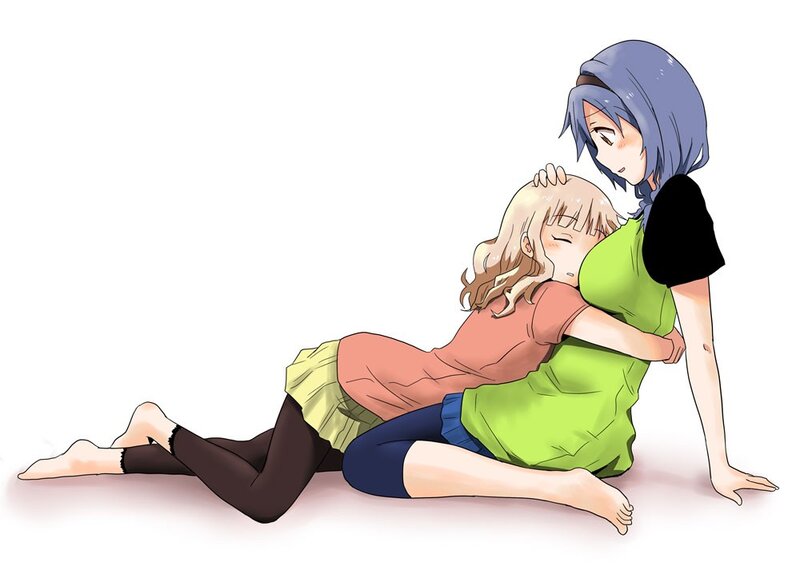 Two girls hugging on the floor