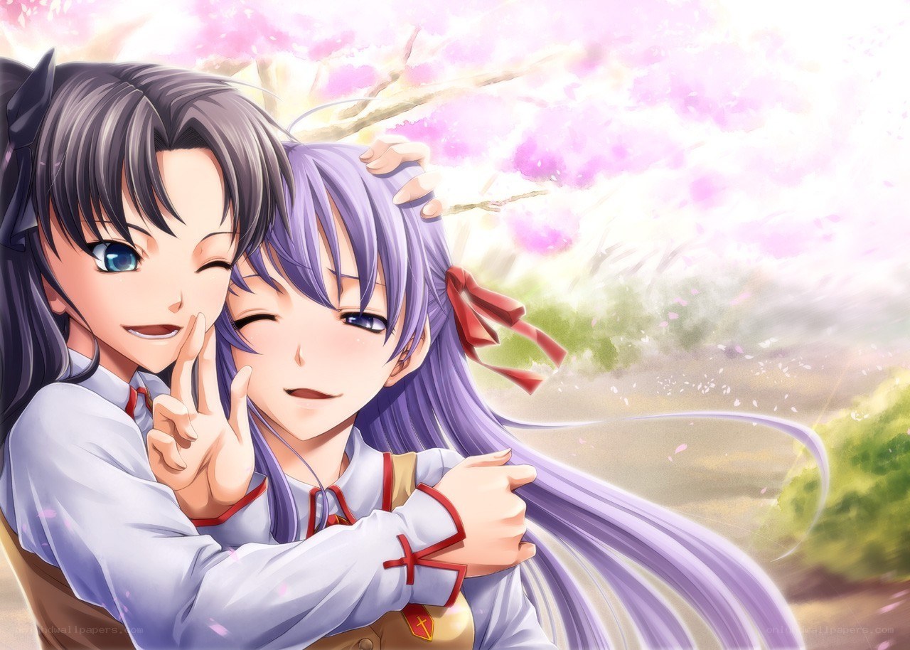 Two girls hugging under cherry blossoms