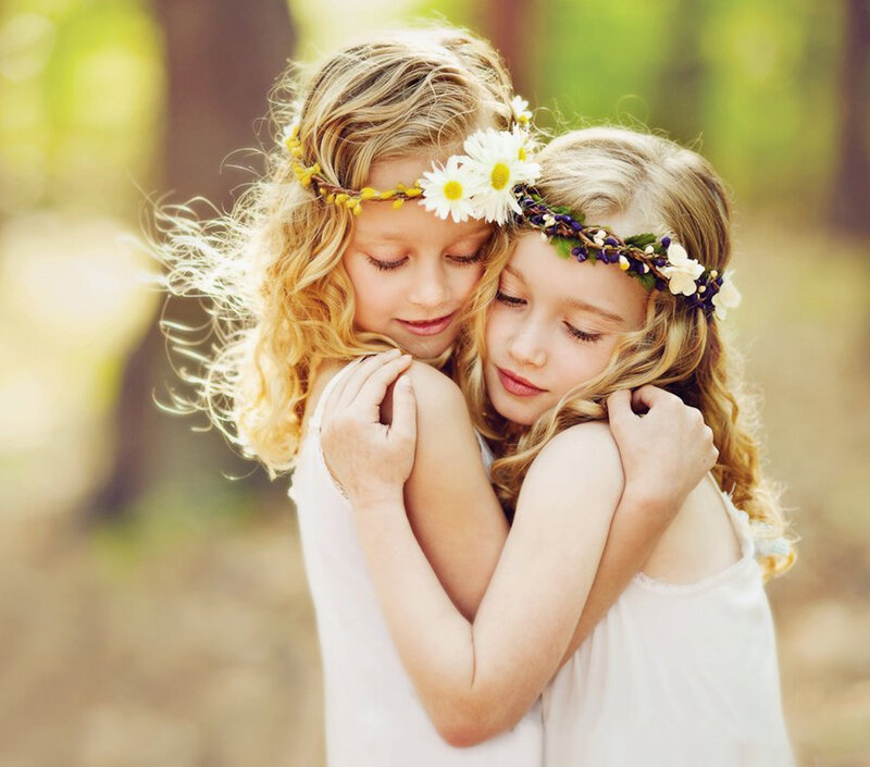 Two Girls Hugging — White, Serene