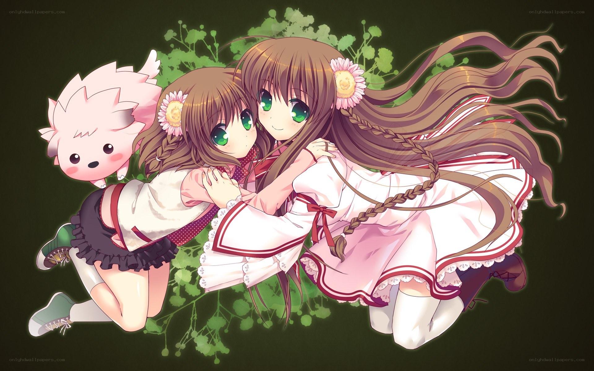 Two girls hugging with a small creature