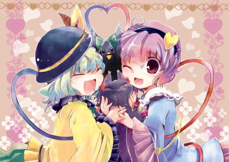 Two girls hugging with cats