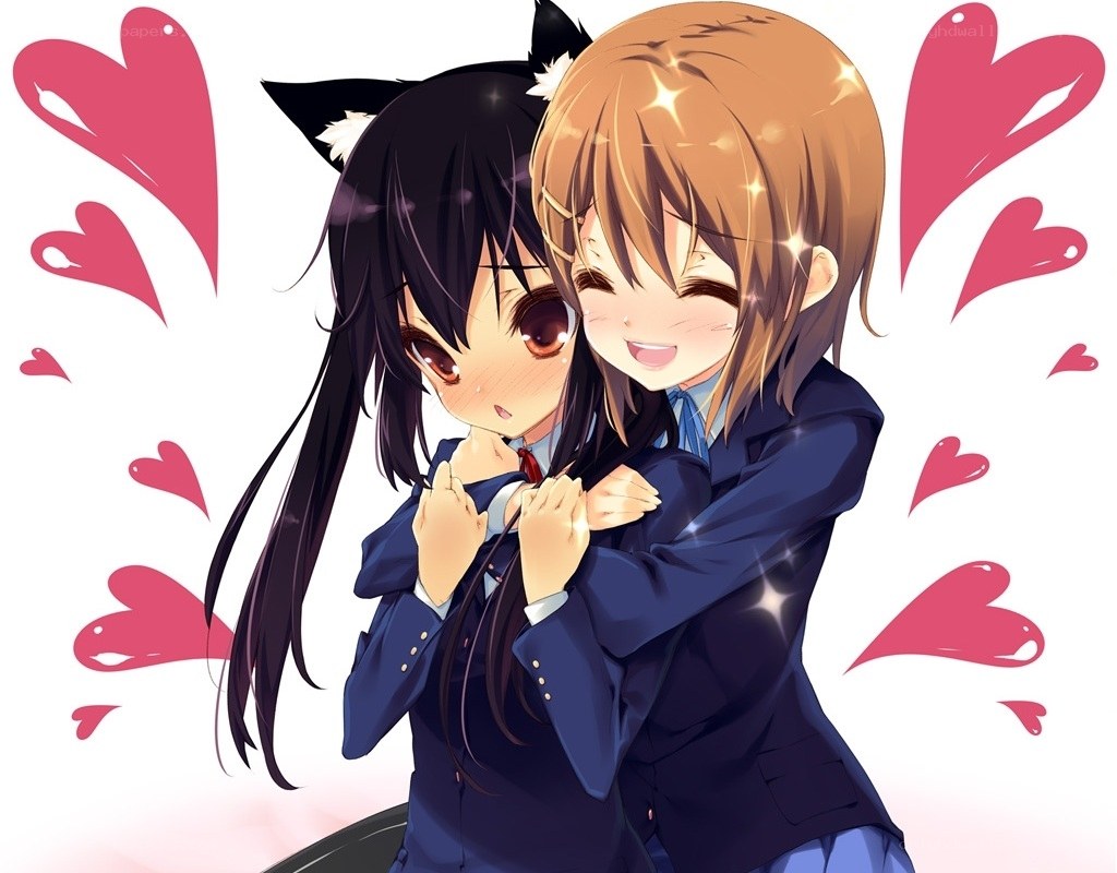 Two girls hugging with hearts