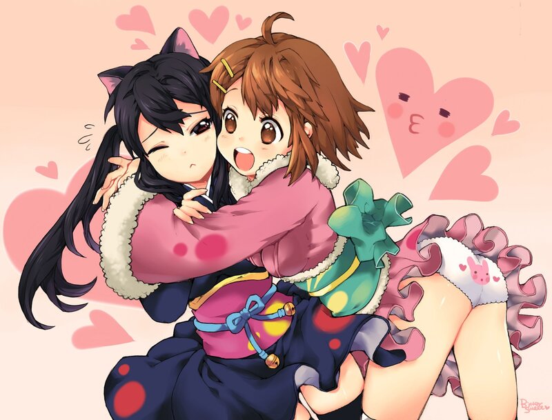 Two girls hugging with hearts
