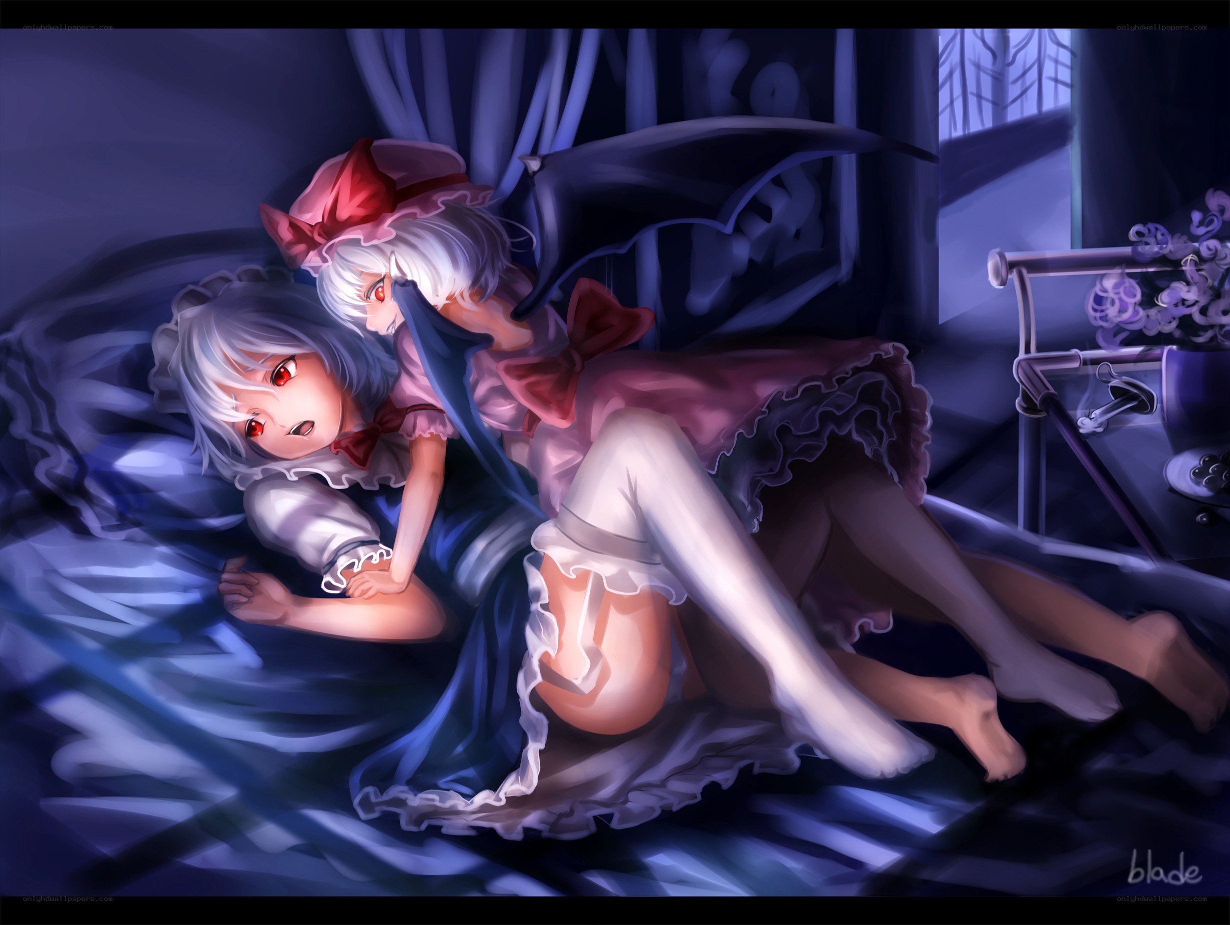 Two girls in a bed at night