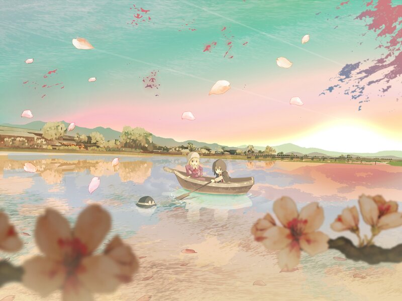 Two girls in a boat at sunset
