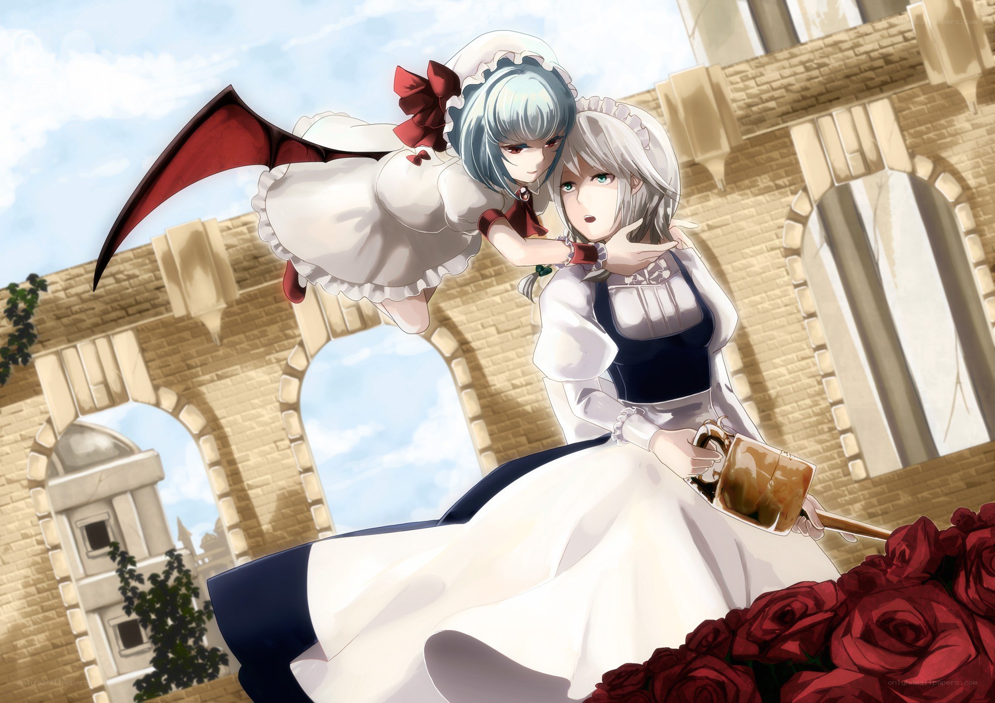 Two girls in a castle courtyard