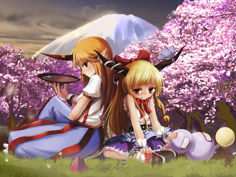 Two girls in a cherry blossom field