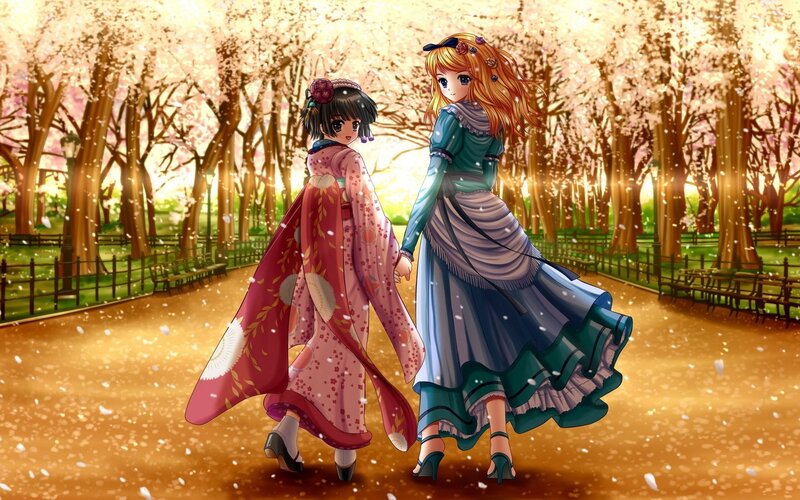 Two girls in a cherry blossom park