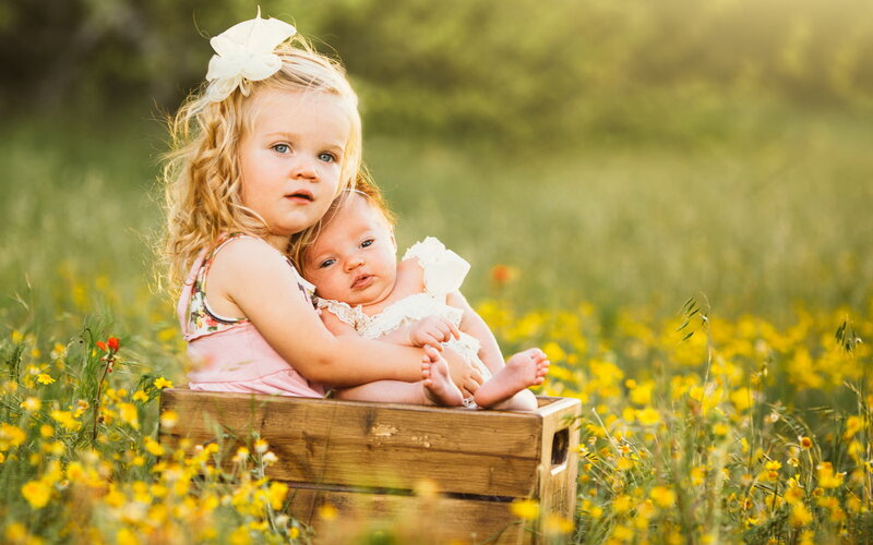 Two Girls in a Crate