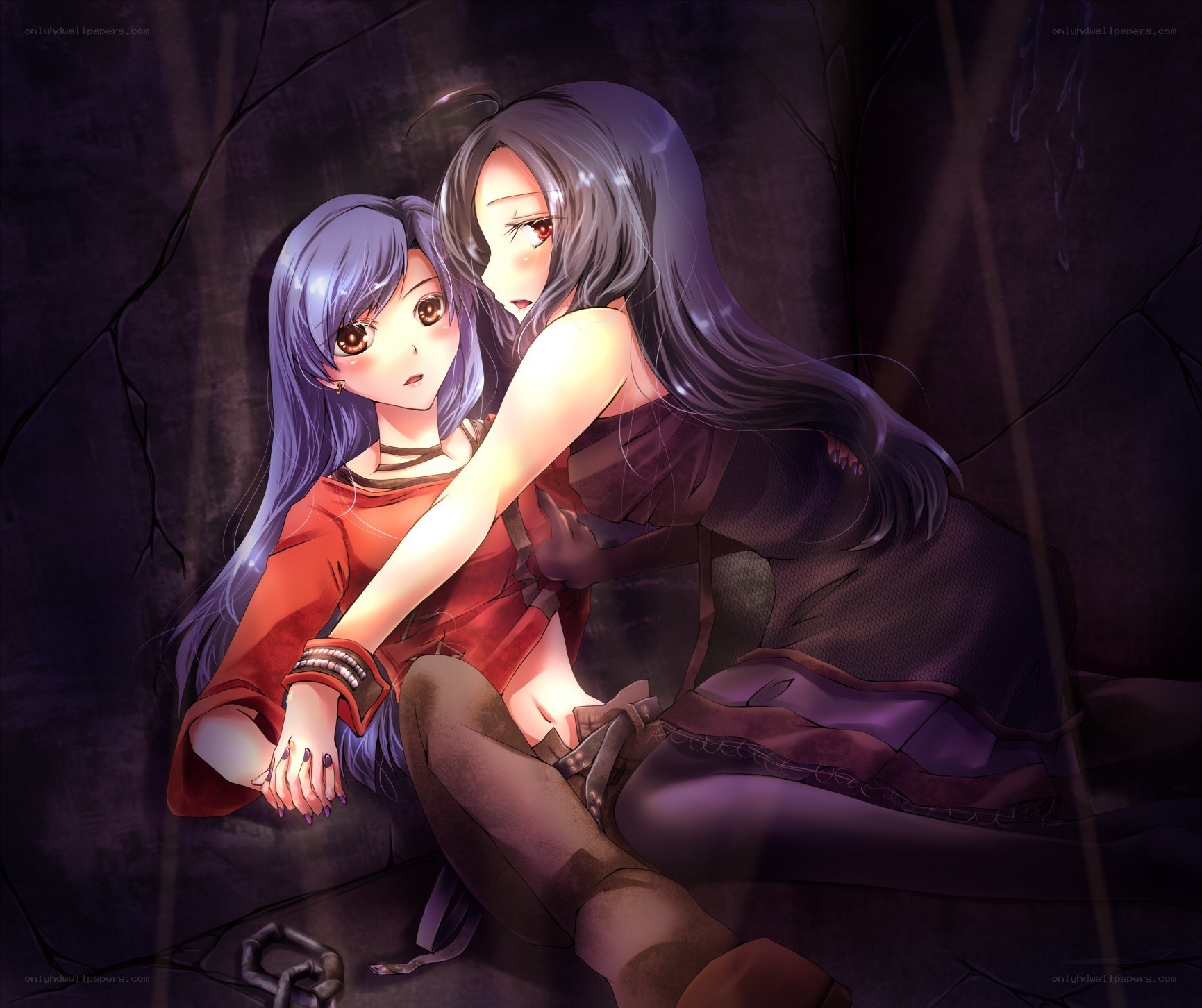 Two girls in a dark cave