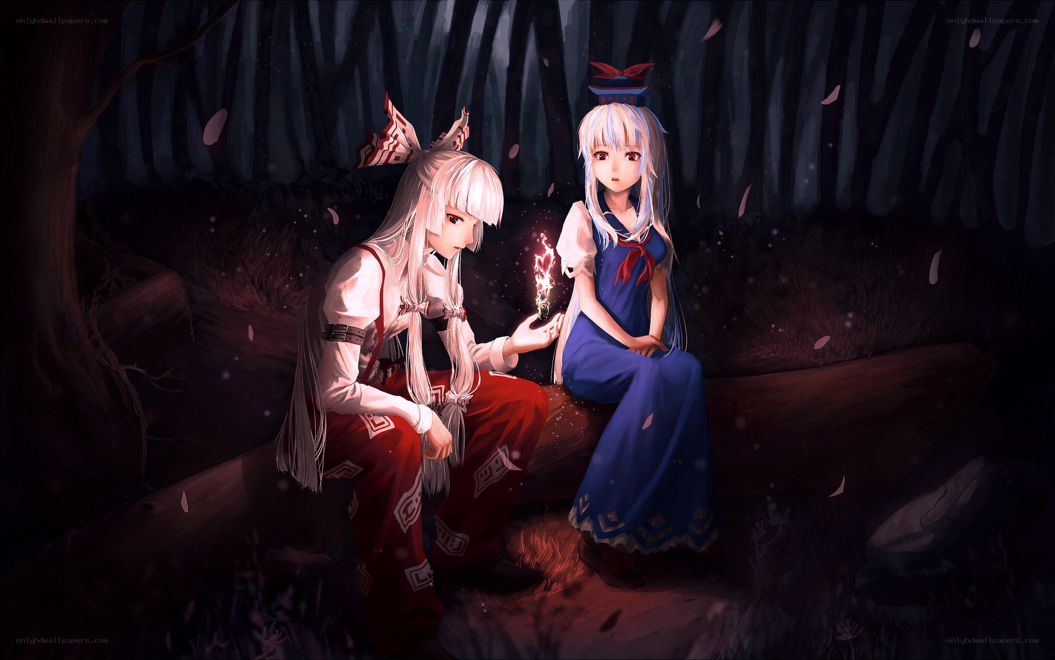 Two girls in a dark forest